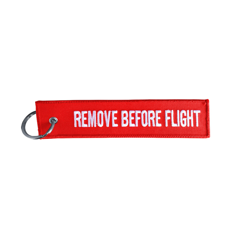 Simoni Racing Sleutelhanger Remove Before Flight - Rood